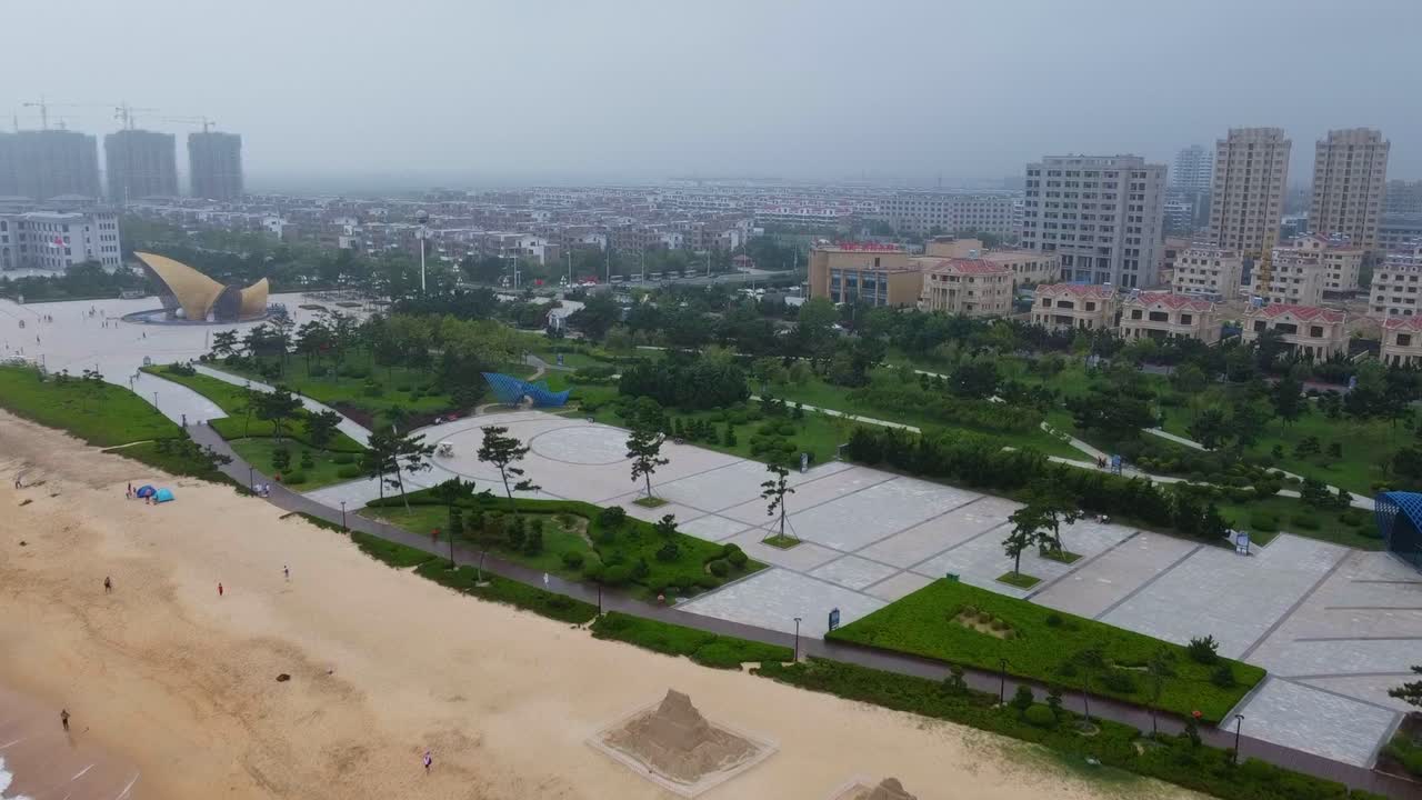 Nanhai beach and cityscape high dolly view