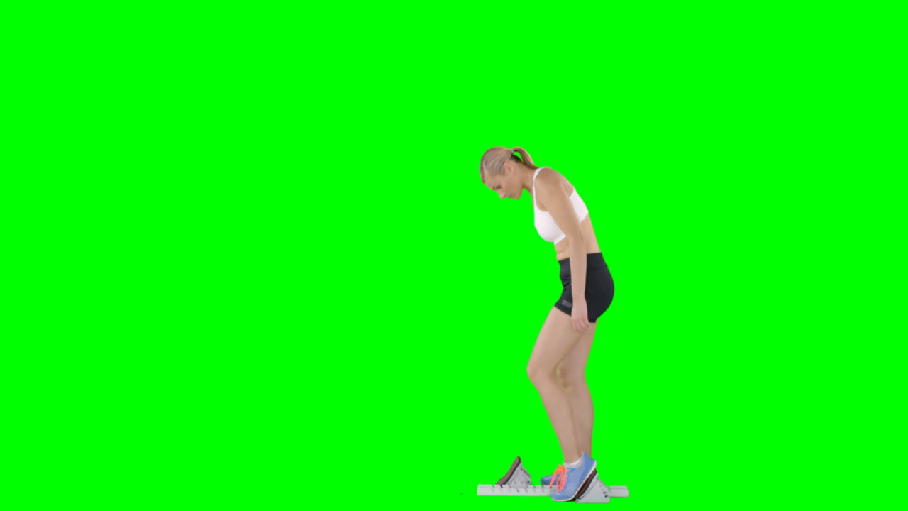 스포츠 여성의 프로필 뷰는 출발을 준비하고 있습니다.