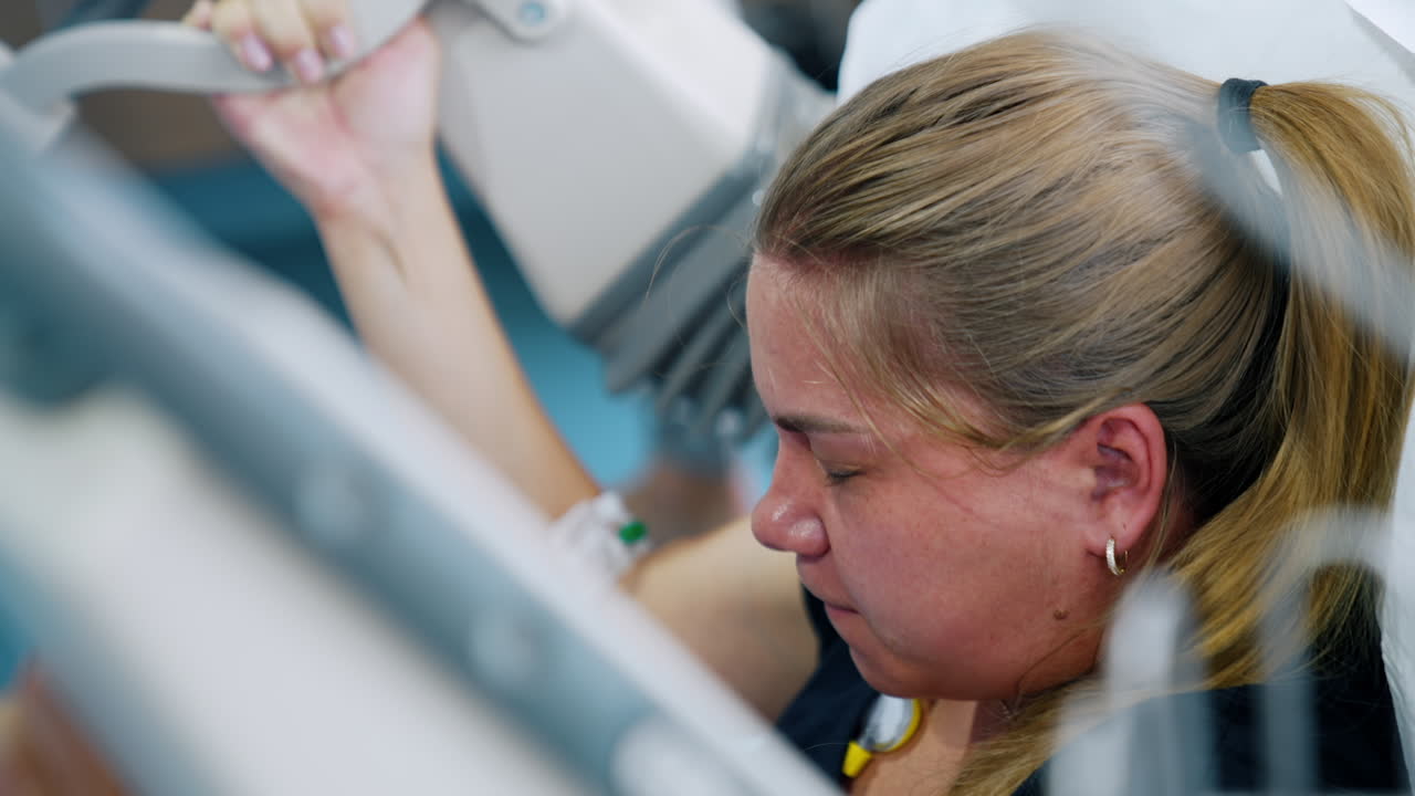 Woman is giving birth to a baby. Painful contraction period changes to a time of relief. Close up.
