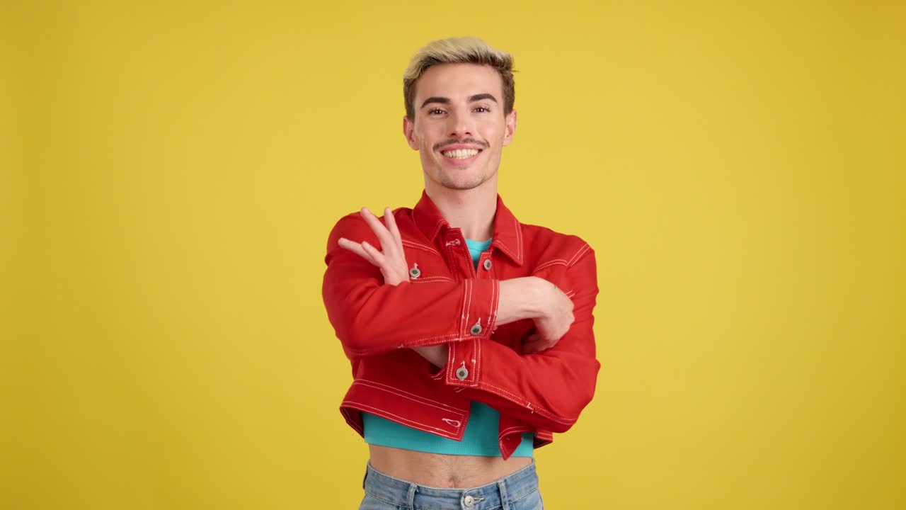 Man in red denim jacket with arms crossed