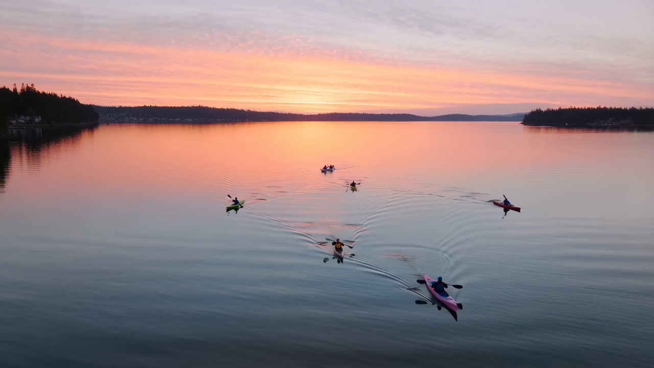 Group Kayaking on Calm Water at Sunset