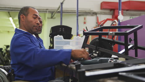 mechanics assembling the wheels with an object