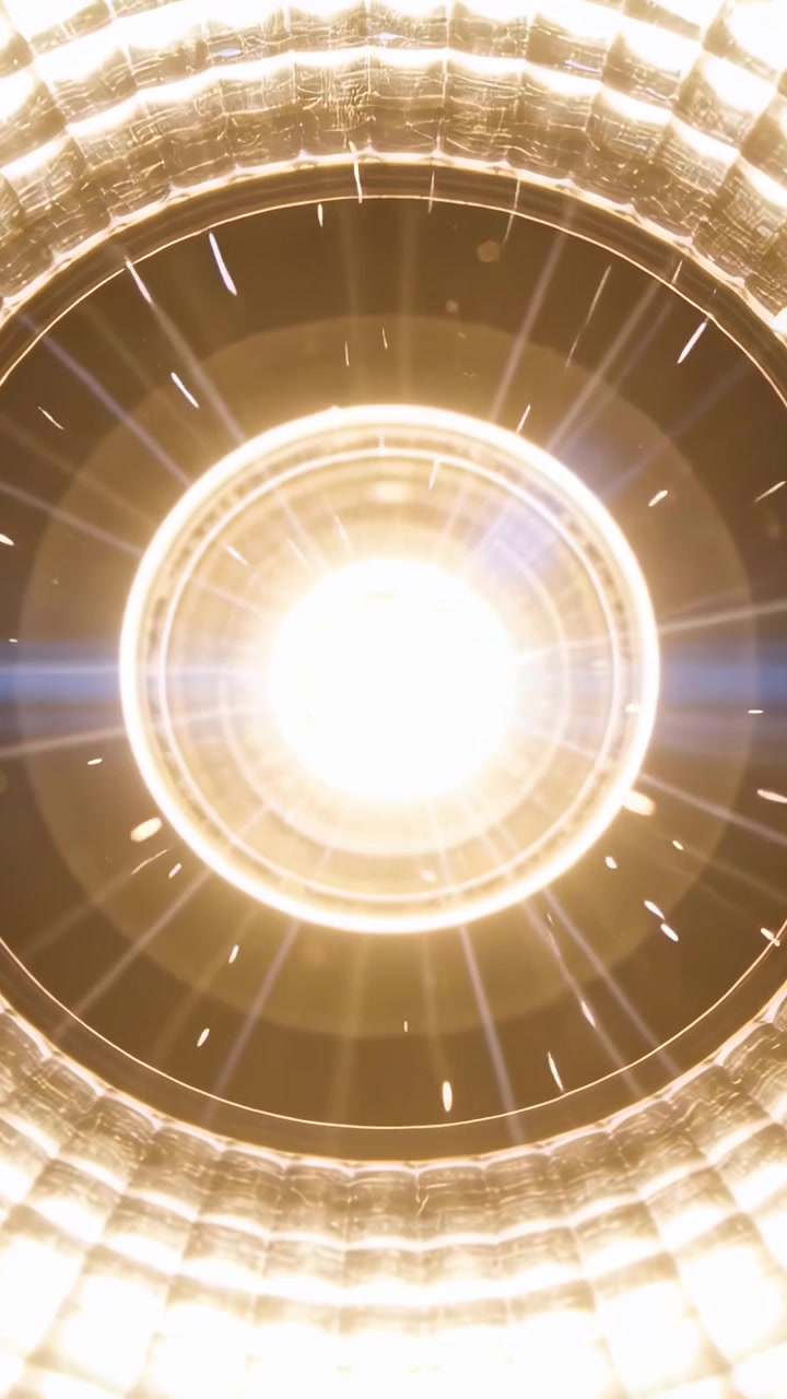 Vertical video: Recording light throwing glare and rings in ceiling fixture, showing particles