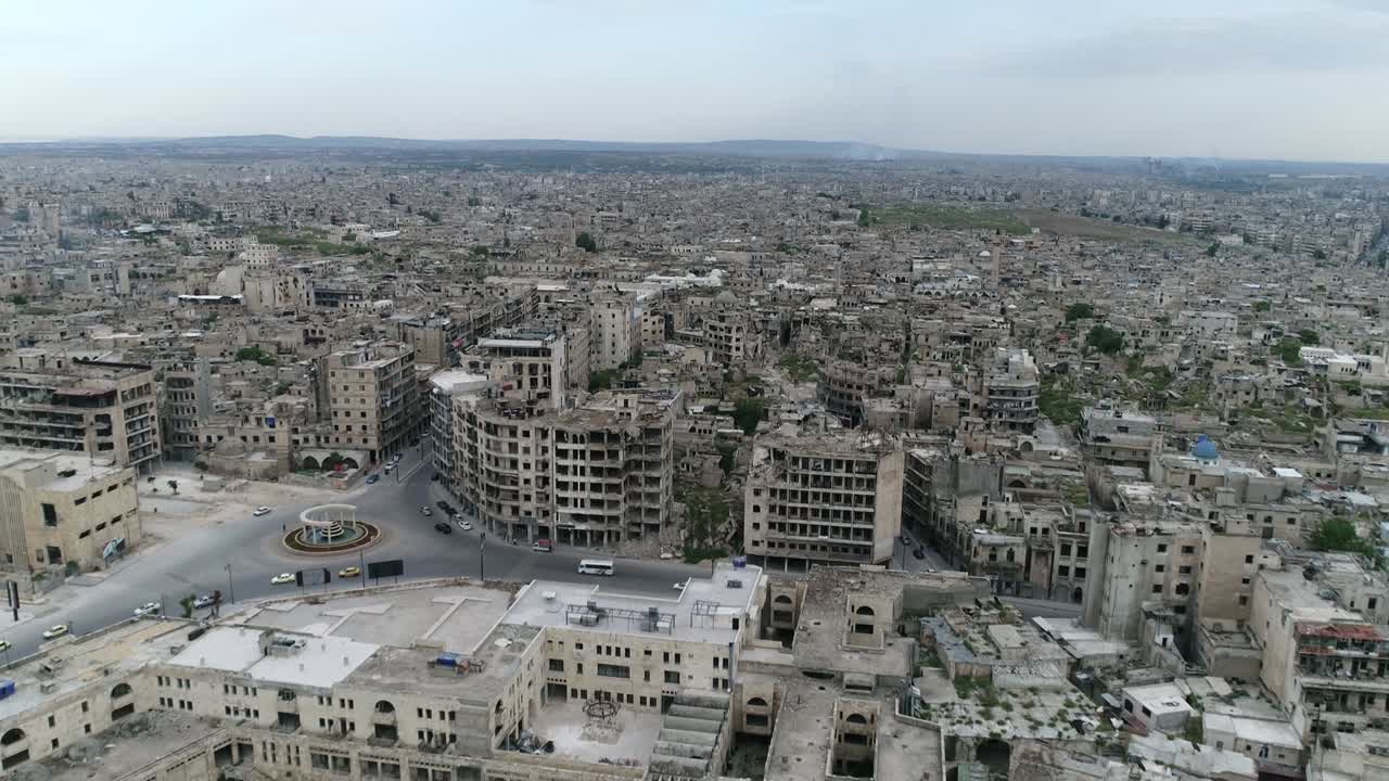 Aleppo in Syria 10 years after the civil war. We can see busy streets in the city, with cars and people  in aerial view 4K