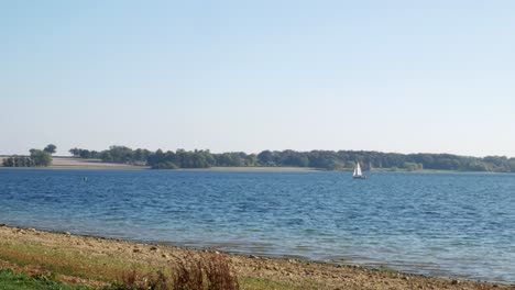 panning shot of boat sailing on a lake - 4k