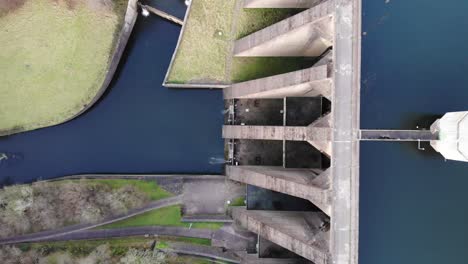 aerial top down view of high walled concrete dam at wimbleball lake