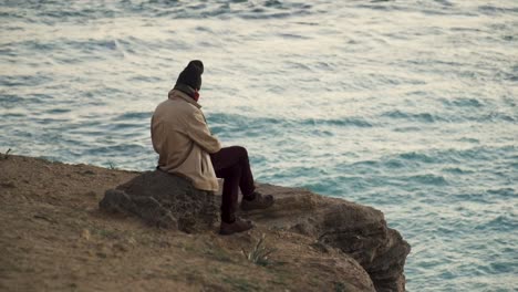 Slow-Motion-Of-Man-Watching-Sunset-In-Beautiful-Sea-View,-Cadiz,-Spain