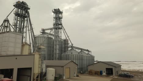 Drone-shot-of-a-semi-loading-feed-at-a-farm's-feed-mill-in-Minnesota