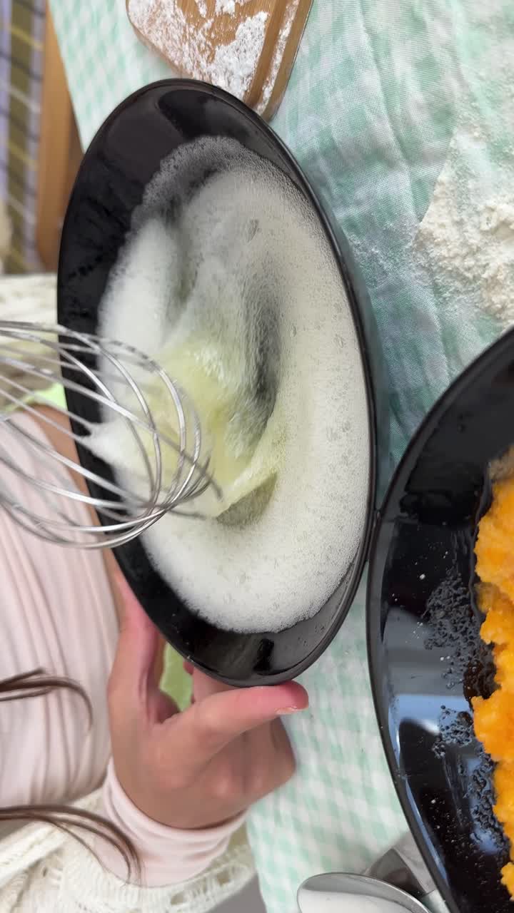 Preparing egg whites and pumpkin puree for baking