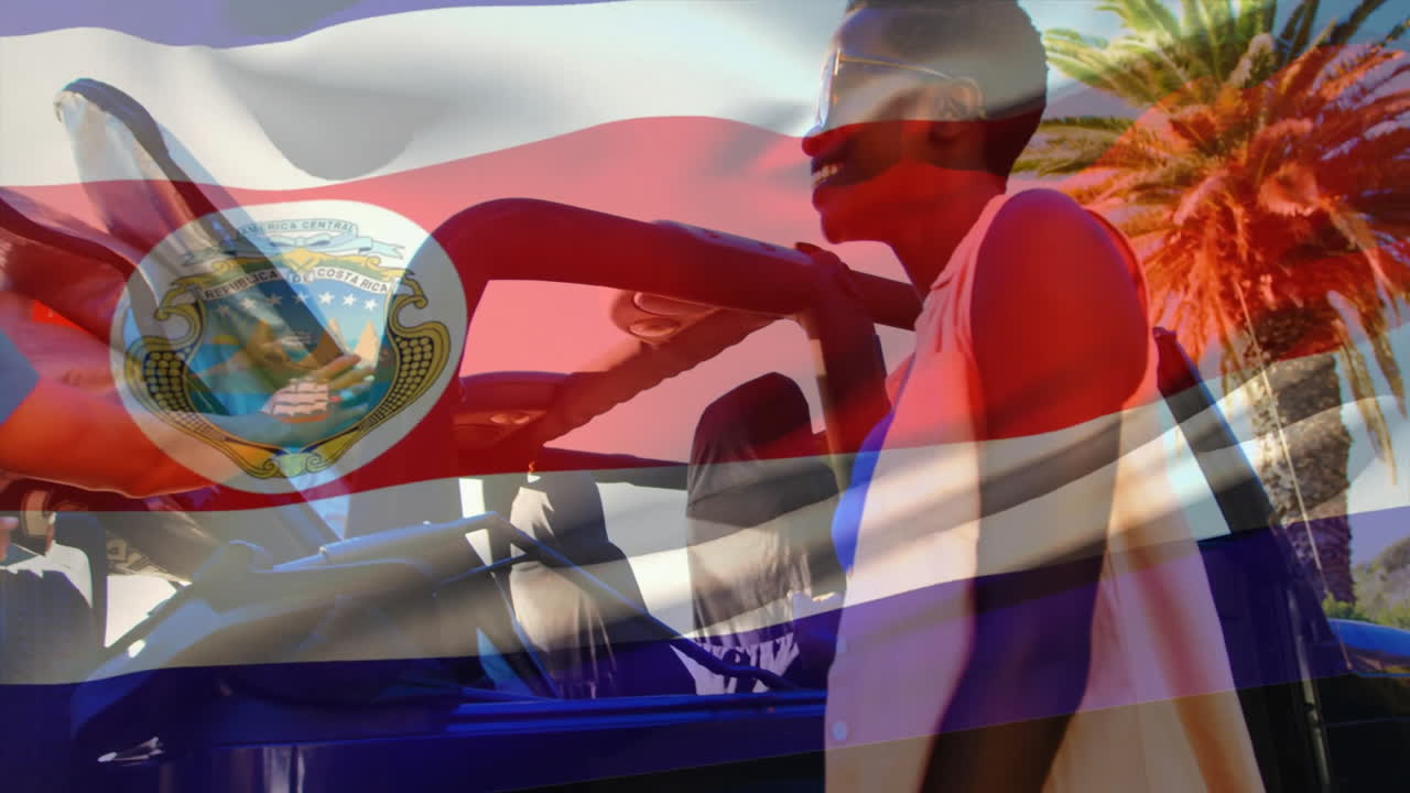 Animation of Costa Rican flag overlaying people interacting outdoors in sunny weather