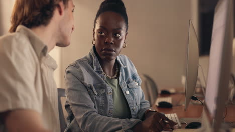 two students working together on a computer