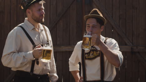 men celebrating oktoberfest with beer