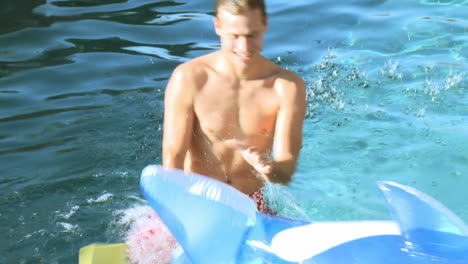 Father-and-son-playing-in-a-swimming-pool