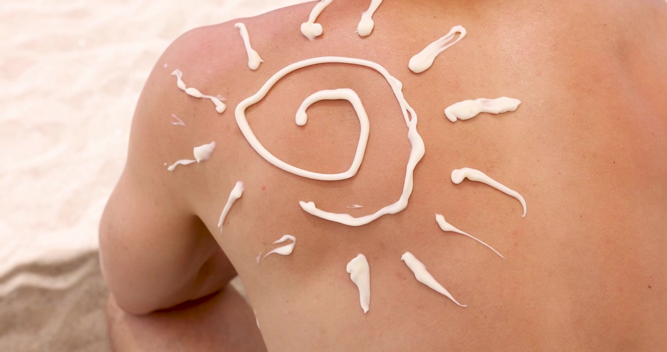 Sun shaped sunscreen applied to man back 4k movie