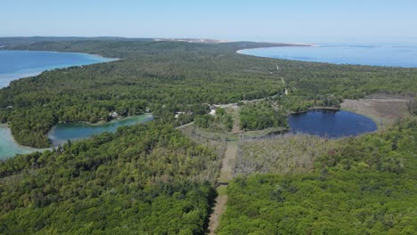 crystal river connecting glen lake with fischer lake, aerial drone view