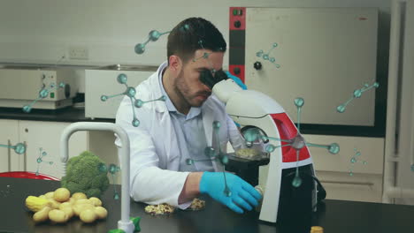 animación de moléculas y procesamiento de datos sobre científico masculino biracial en el laboratorio