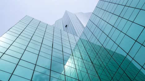 Time-lapse-of-modern-high-rise-office-building-looking-up-from-ground