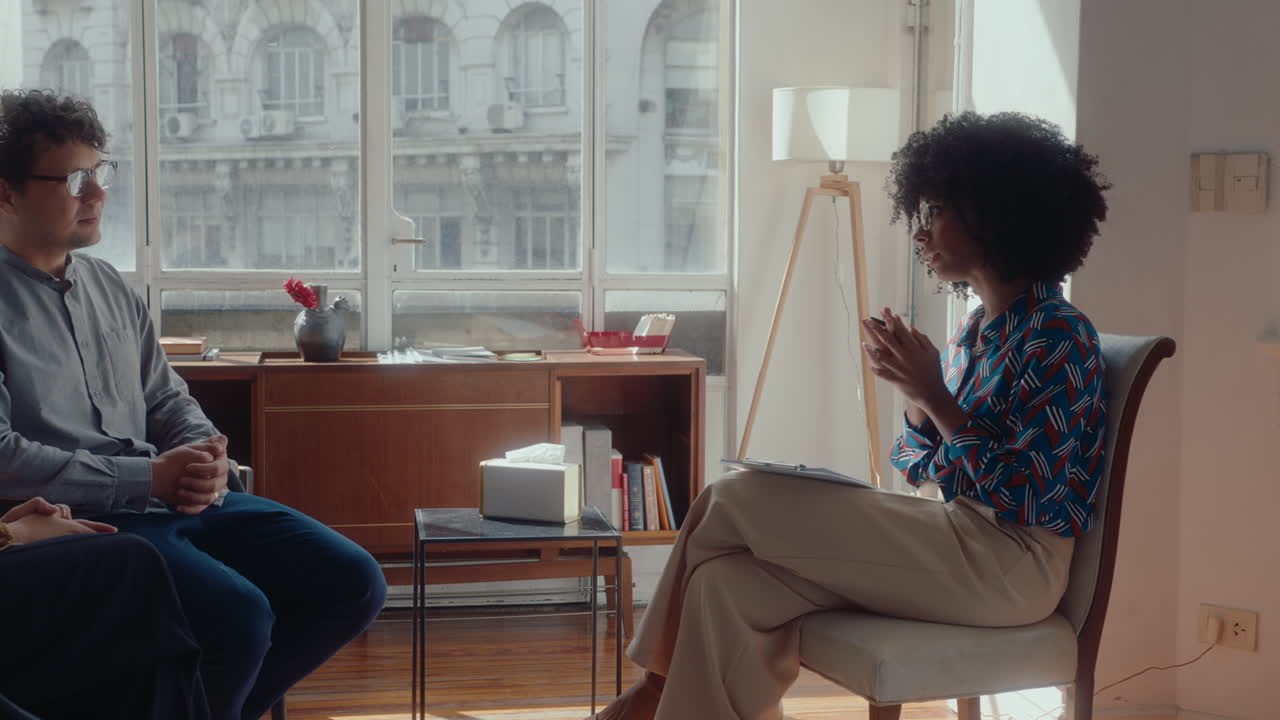 Therapist Consulting Family Couple during Counseling Session