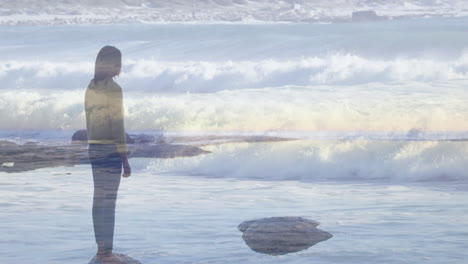 by ocean, person contemplating nature's beauty with waves crashing around them