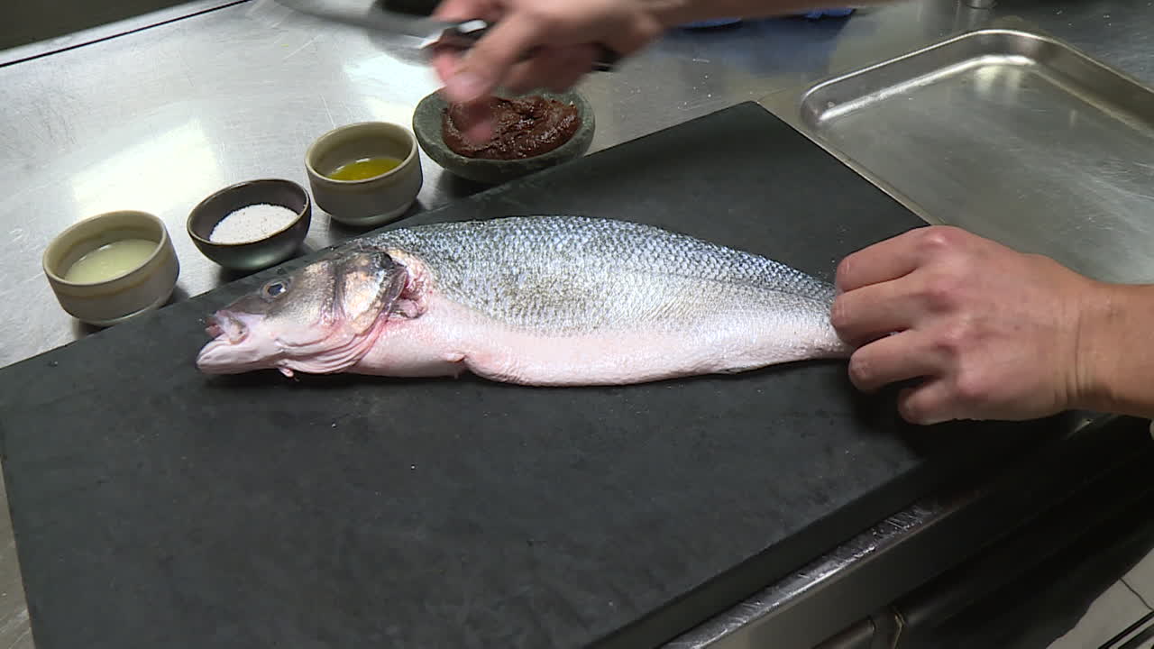 Chef Filleting a Fish