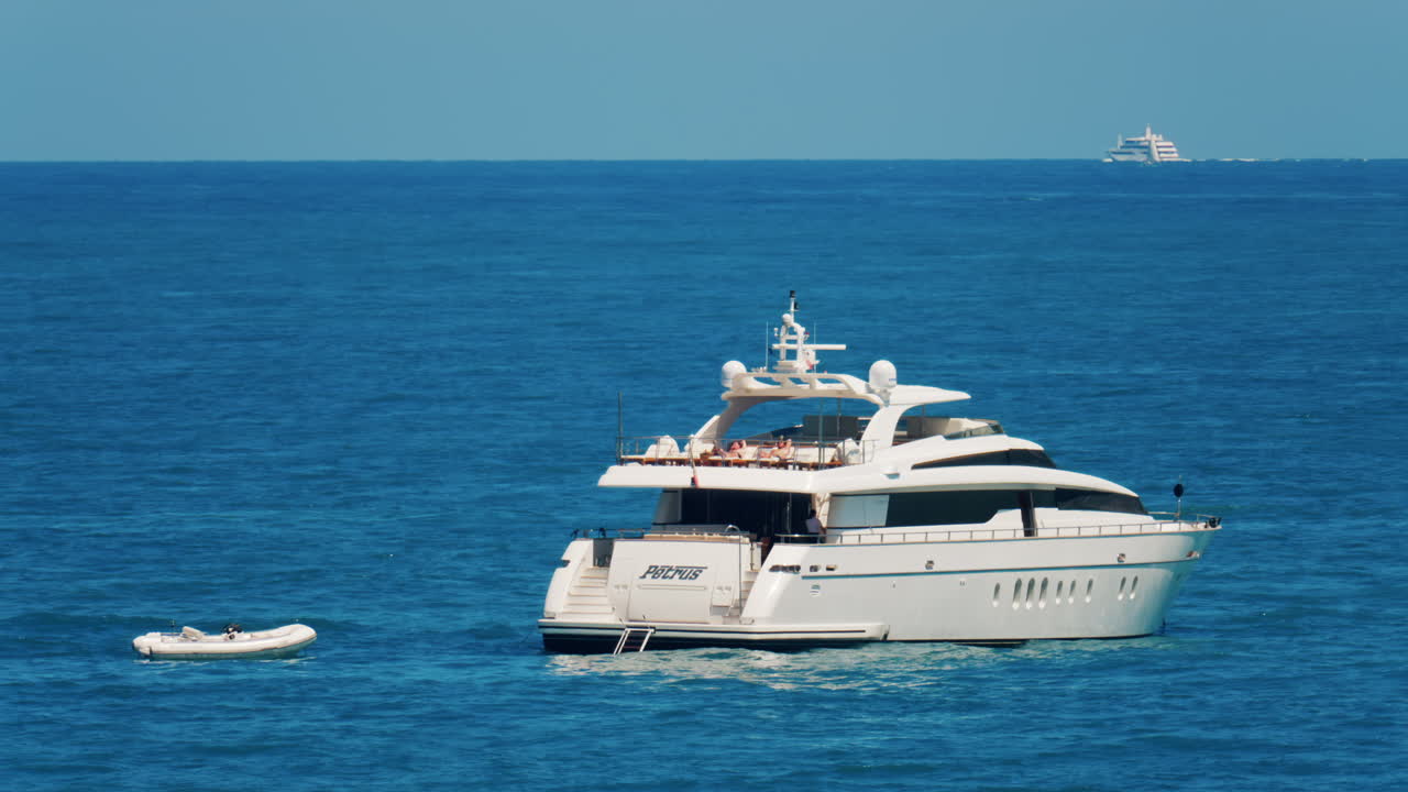 Antibes, France - May 24, 2025: Ships moving on the Mediterranean sea in daylight