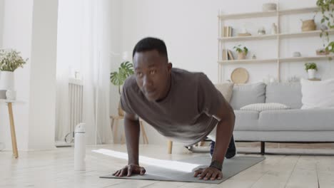 man doing push-ups at home