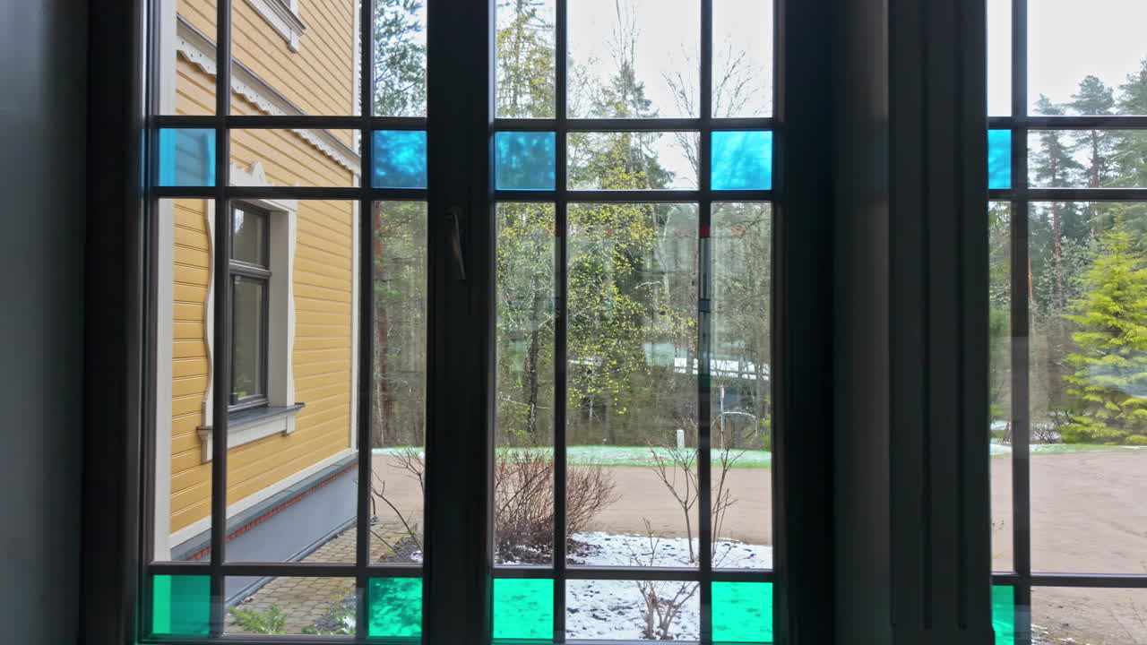 Sliding windows from inside a building to a garden or forest truck shot slow motion