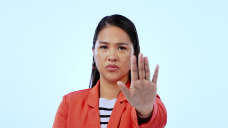 japanese woman, hand and stop in studio with face