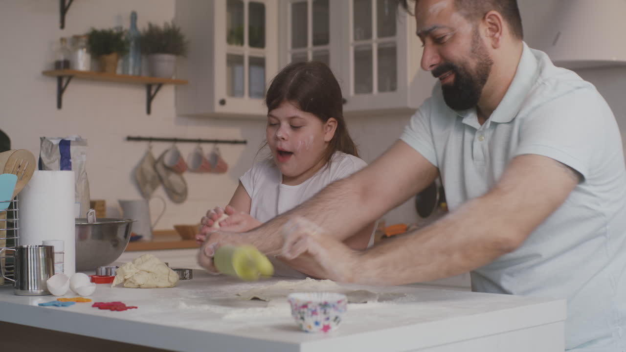 a Father Watches his Daughter Doing a Cartwheel in an Airport Terminal Preparing for a Flight a Father and Daughter Share a Playful Moment at an Airport with the Little Girl Doing a Cartwheel as they Wait for their Flight