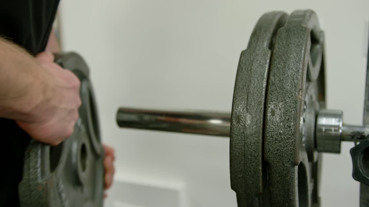 Strong bodybuilder lifting weights. Athletic person effort