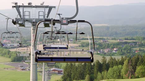 Empty-stopped-ski-lift-during-summer-with-nobody,-medium-shot