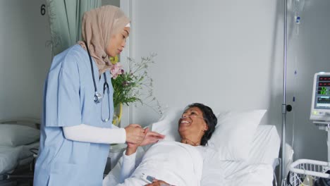 female doctor comforting patient lying on hospital bed 4k