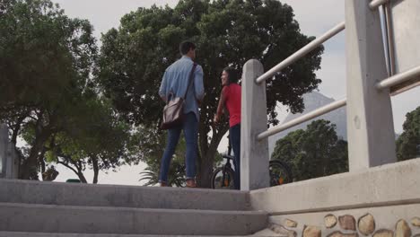 Young-couple-with-skate-and-bike