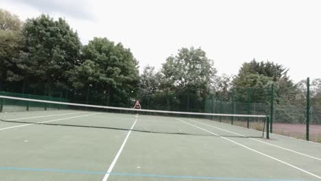 point of view shot of amateur tennis player playing in park with female player