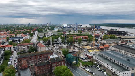 aerial of new construction development site in the baltic city near the river