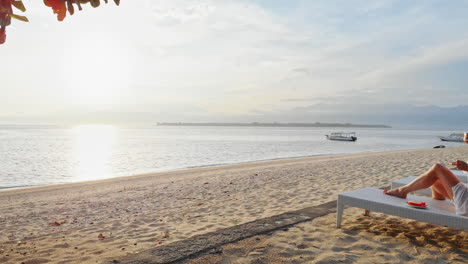 Beautiful-woman-drinking-coffee-in-tropical-paradise-beach-resort