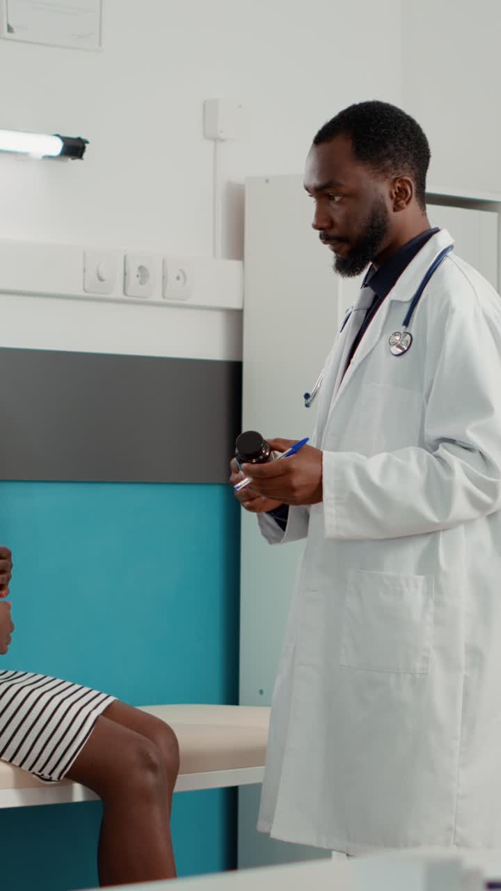 Pregnant Woman Consults with Doctor During Prenatal Checkup