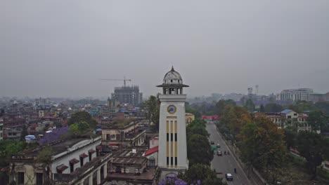 aerial view of kathmandu cityscape with historic clock tower and jacaranda trees