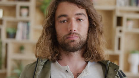 close up portrait of relaxed young man student looking confident with long hair real people series