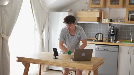 man working from home in his kitchen