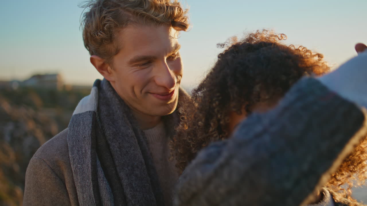 Tender couple flirting evening coast closeup. Gentle man swirling happy woman