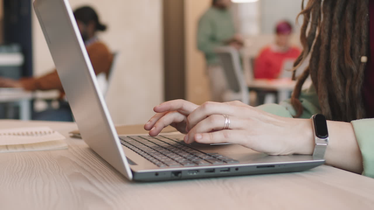 Unrecognizable Businesswoman Working on Laptop