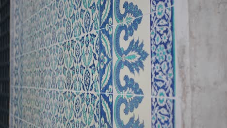 blue and white tiled wall with intricate patterns