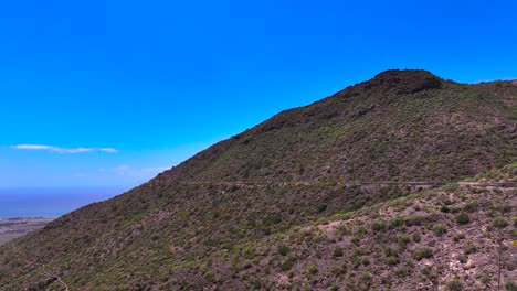 volcanic mountain view with irrigation ditches in adeje, tenerife, canary islands