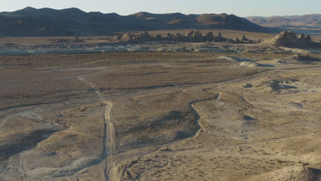 wide drone shot revealing landsite filled with geographical wonder of pinnacles in the desert