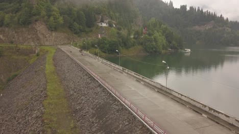 aerial view of the dam at colibita lake during tura tu copaci 8 bike race