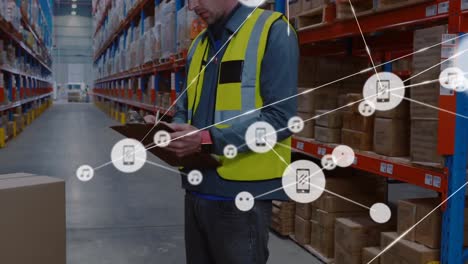 animation of network of digital icons over caucasian male supervisor checking stock at warehouse