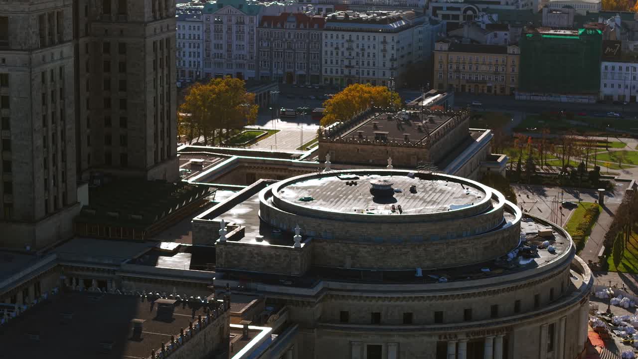 Warsaw, Poland. Aerial View, Palace of Culture and Science Building, Circular Left Wing and Street Traffic on Sunny Autumn Day
