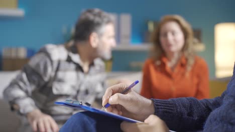 Psychiatrist-taking-notes-while-married-couple-discussing.-Family-problems.