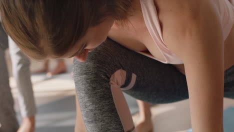 yoga-class-portrait-attractive-woman-practicing-low-lunge-pose-enjoying-healthy-lifestyle-exercising-flexible-body-in-fitness-studio-group-meditation